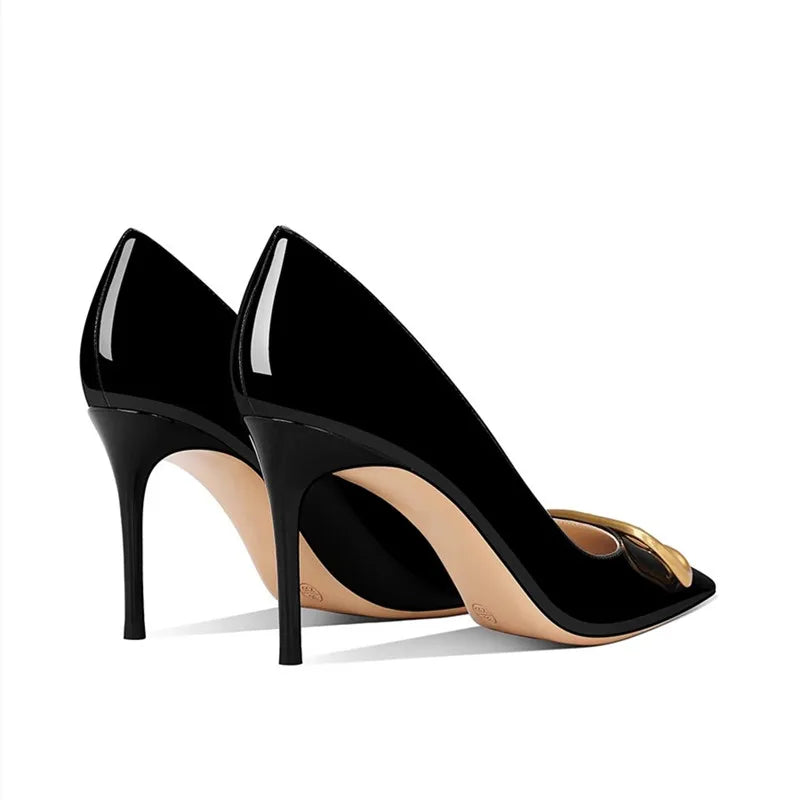Genuine leather high-heeled shoes with pointed toes and V-shaped buckle embellishment.