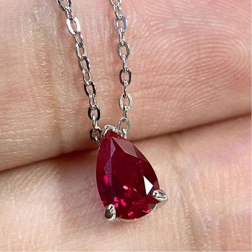 925 Sterling Silver teardrop pendant necklace, set with ruby/moissanite.