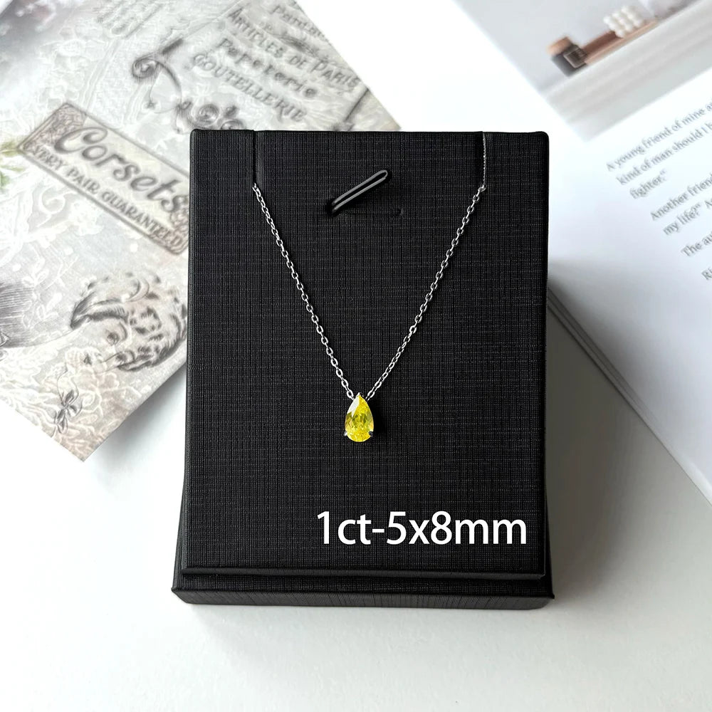 925 Sterling Silver teardrop pendant necklace, set with ruby/moissanite.