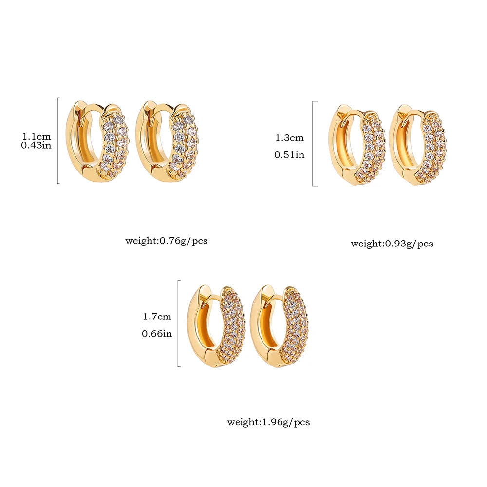 Thin gold-plated huggie hoop earrings with CZ/zircon embellishments, minimalist style.