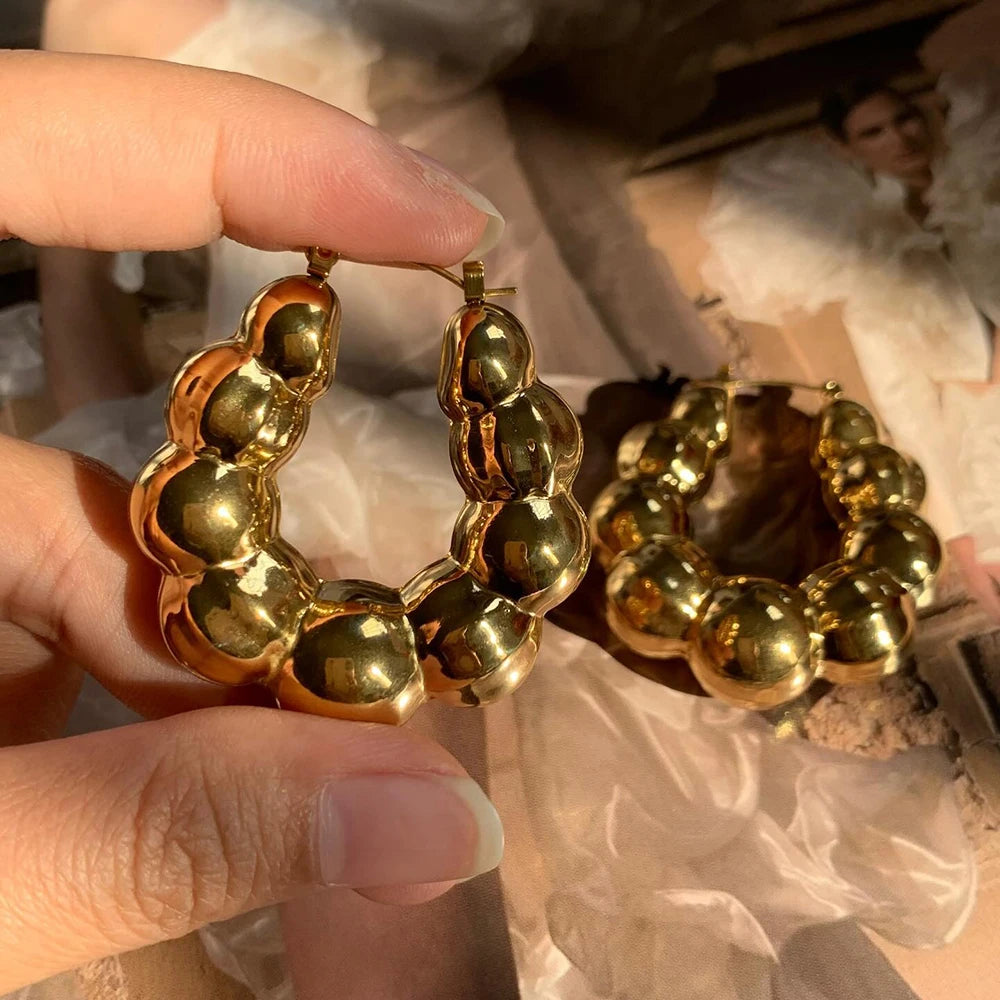 Large thick hoop earrings, gold plated stainless steel, lightweight, vintage punk style.