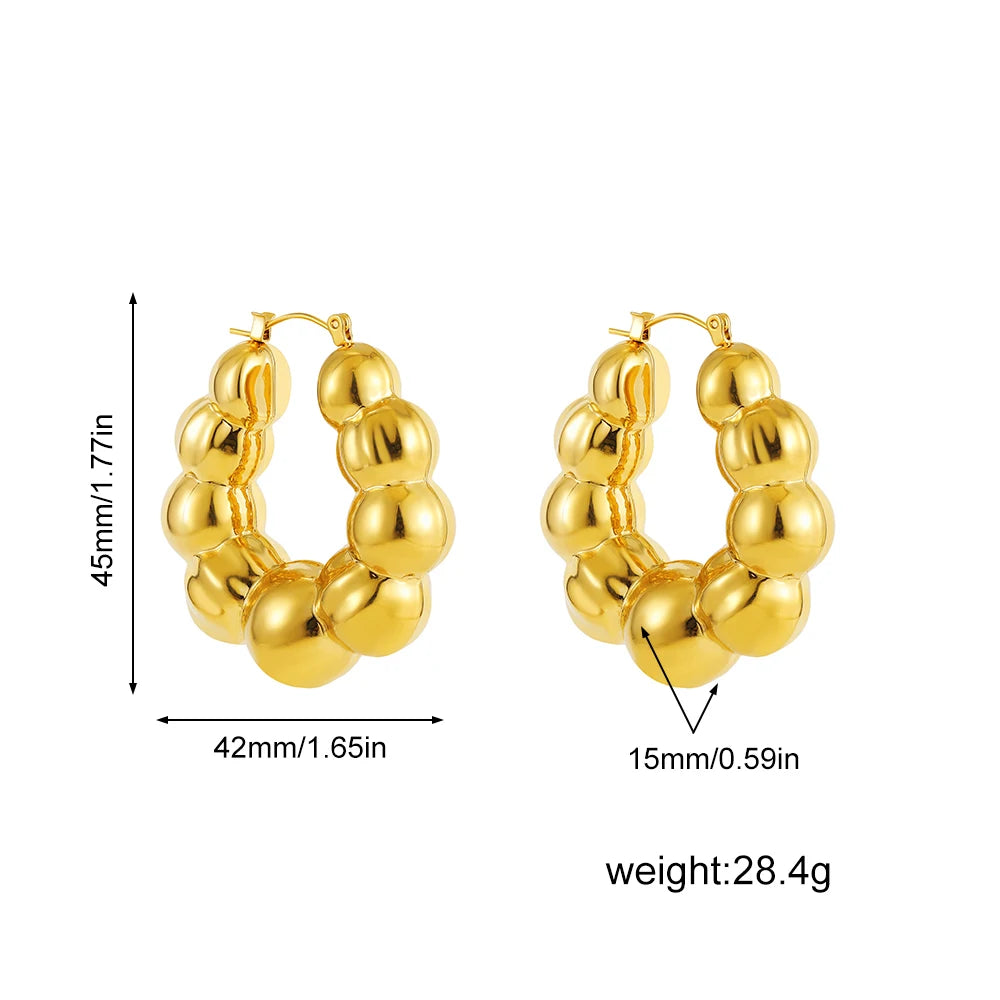 Large thick hoop earrings, gold plated stainless steel, lightweight, vintage punk style.