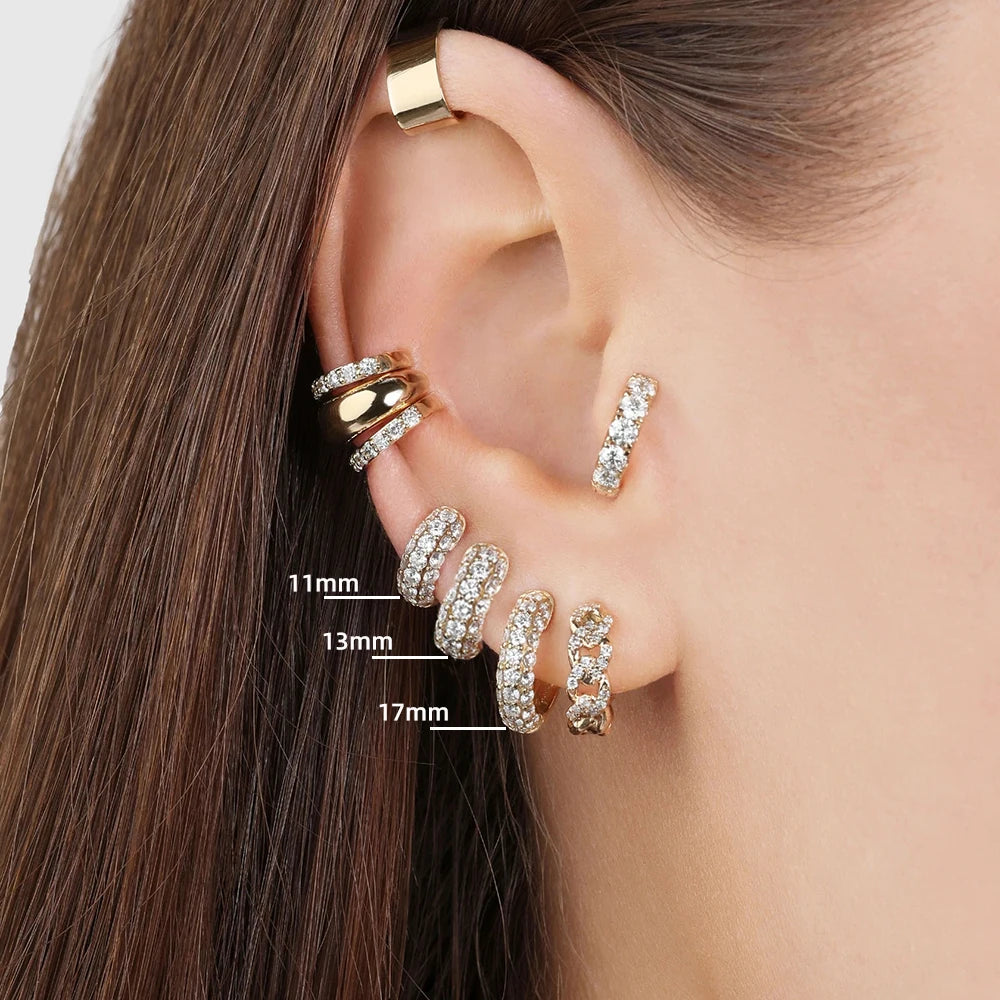 Thin gold-plated huggie hoop earrings with CZ/zircon embellishments, minimalist style.